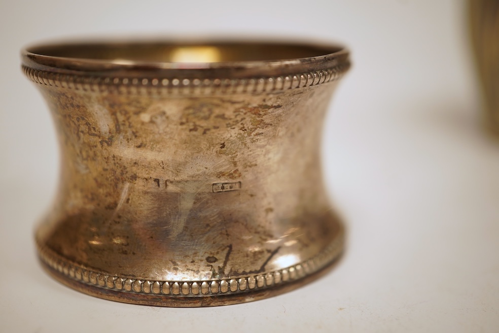 A late Victorian demi-fluted cream jug and sugar bowl, Charles Stuart Harris, London, 1888, together with cased silver christening egg cup, spoon and napkin ring and two other silver napkin rings.